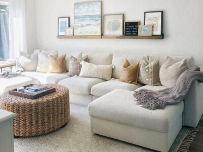 Living room with beige couch and storage ottoman