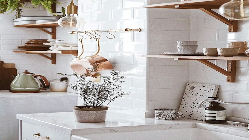 White countertop in a kitchen with wood floating shelves